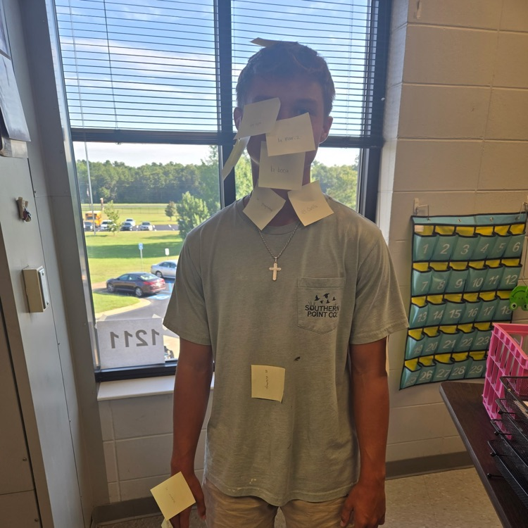 Students in Mrs. Wallace's Spanish 1 class reviewed the body parts by labeling their classmates using the Spanish words. 