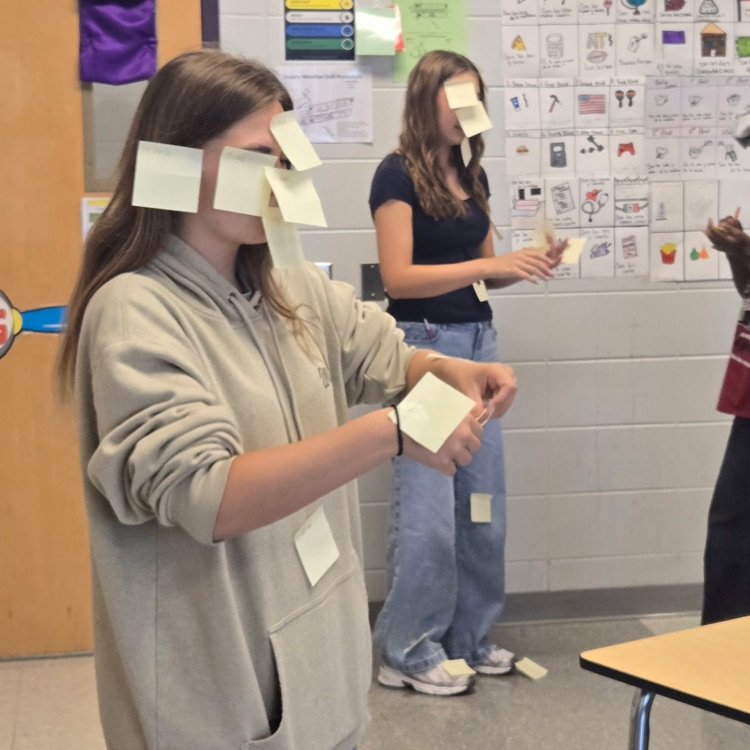Students in Mrs. Wallace's Spanish 1 class reviewed the body parts by labeling their classmates using the Spanish words. 