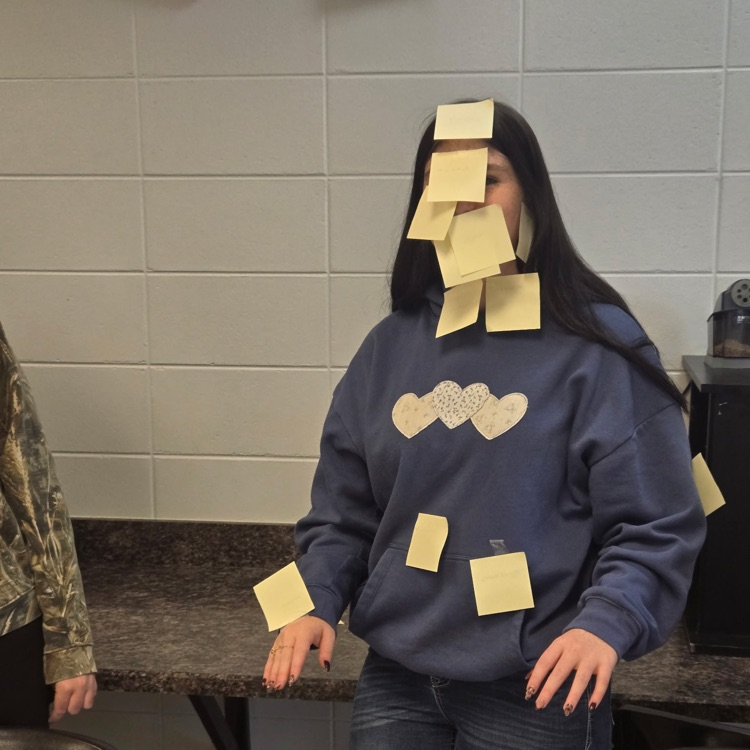 Students in Mrs. Wallace's Spanish 1 class reviewed the body parts by labeling their classmates using the Spanish words. 