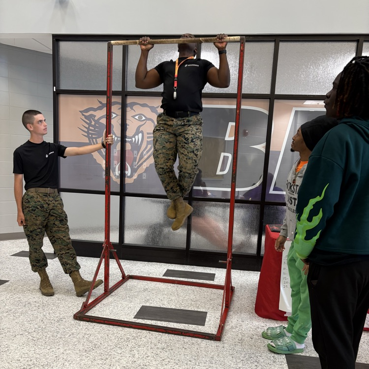 Marine recruiters spoke with students today and tested their strength on the pull-up bar. 