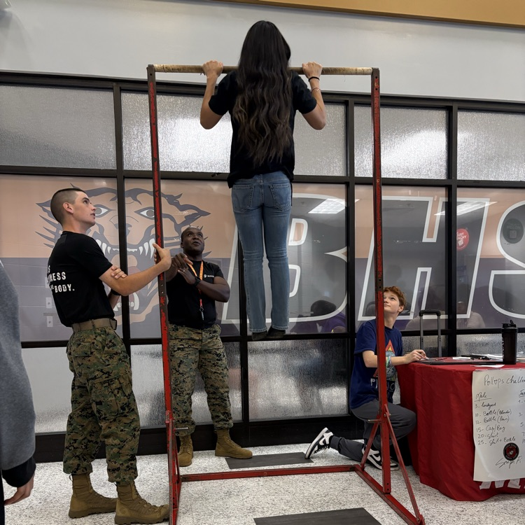 Marine recruiters spoke with students today and tested their strength on the pull-up bar. 