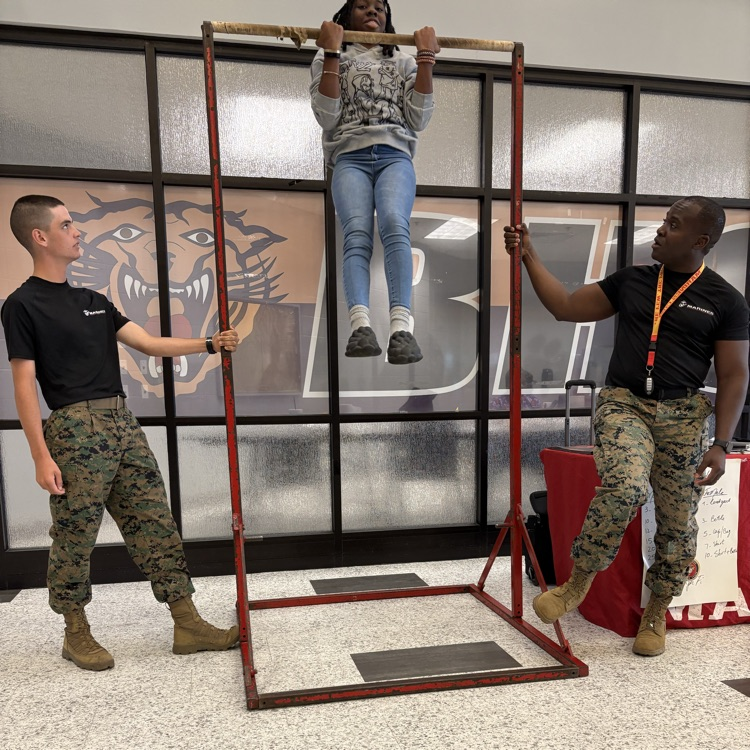 Marine recruiters spoke with students today and tested their strength on the pull-up bar. 