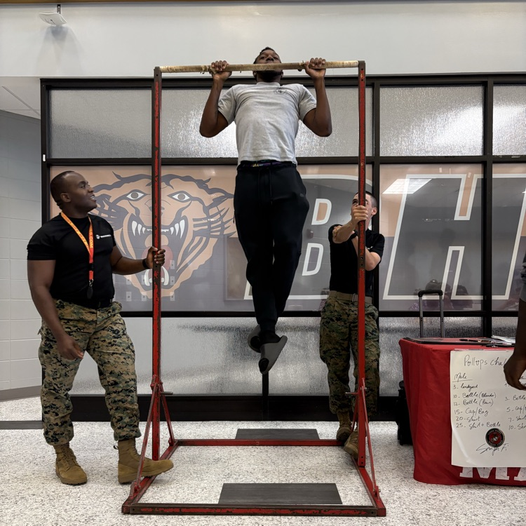 Marine recruiters spoke with students today and tested their strength on the pull-up bar. 