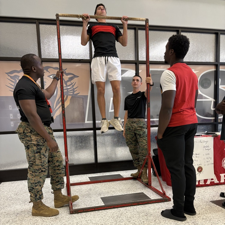Marine recruiters spoke with students today and tested their strength on the pull-up bar. 