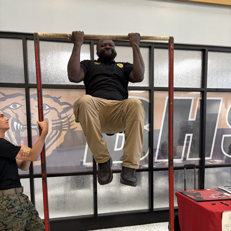 Marine recruiters spoke with students today and tested their strength on the pull-up bar. 