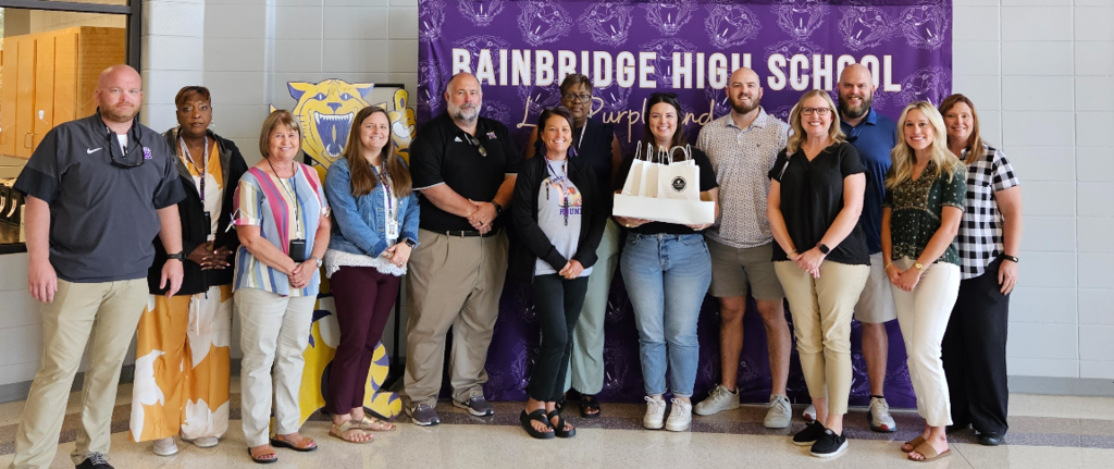 Bainbridge High School staff members with Southwest Church members delivering goodie bags.