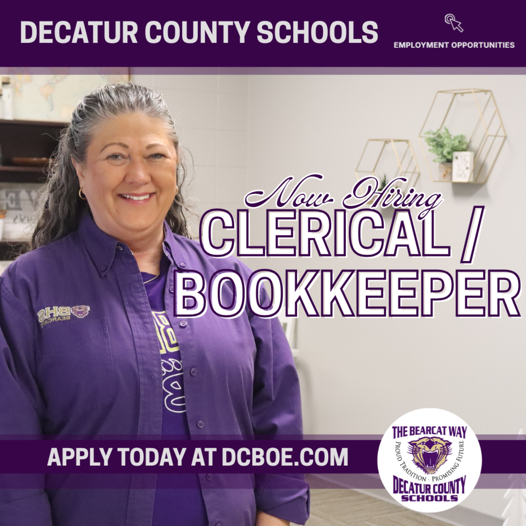 Smiling woman in purple shirt standing in an office. Text reads: Decatur County Schools Now Hiring Clerical / Bookkeeper. Apply today at dcboe.com.