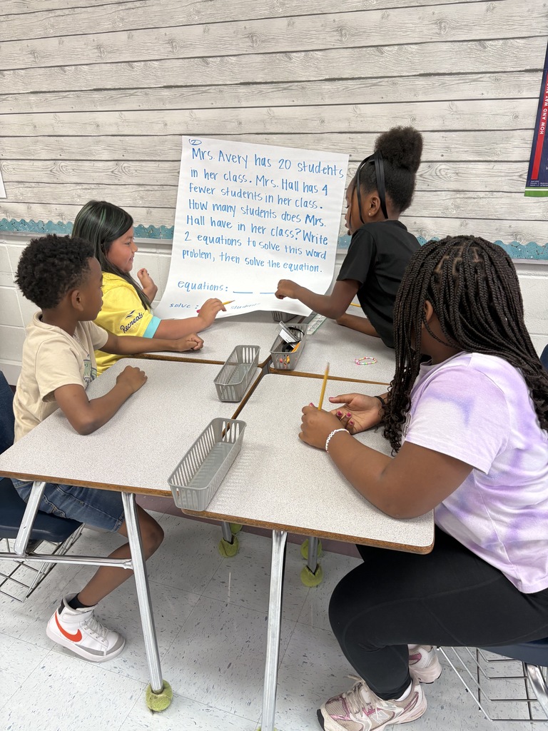 4 students working at a table