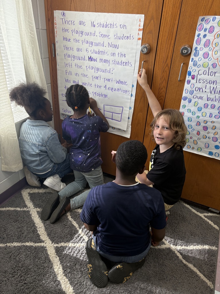 4 students working on the floor