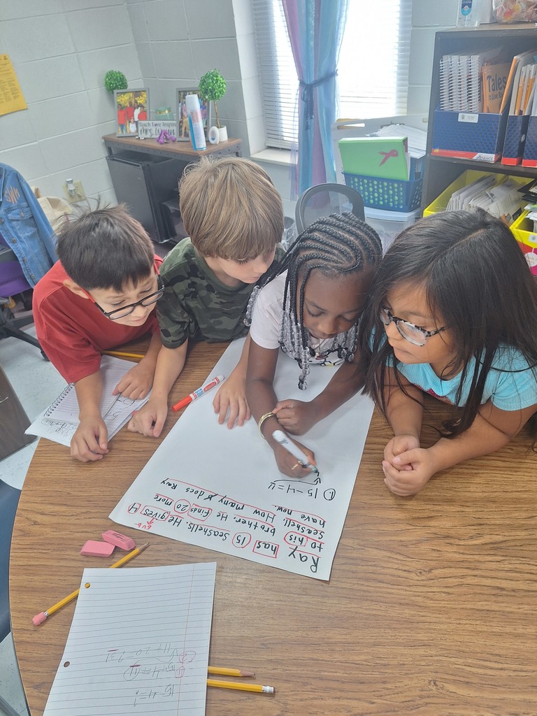 4 students work at a table