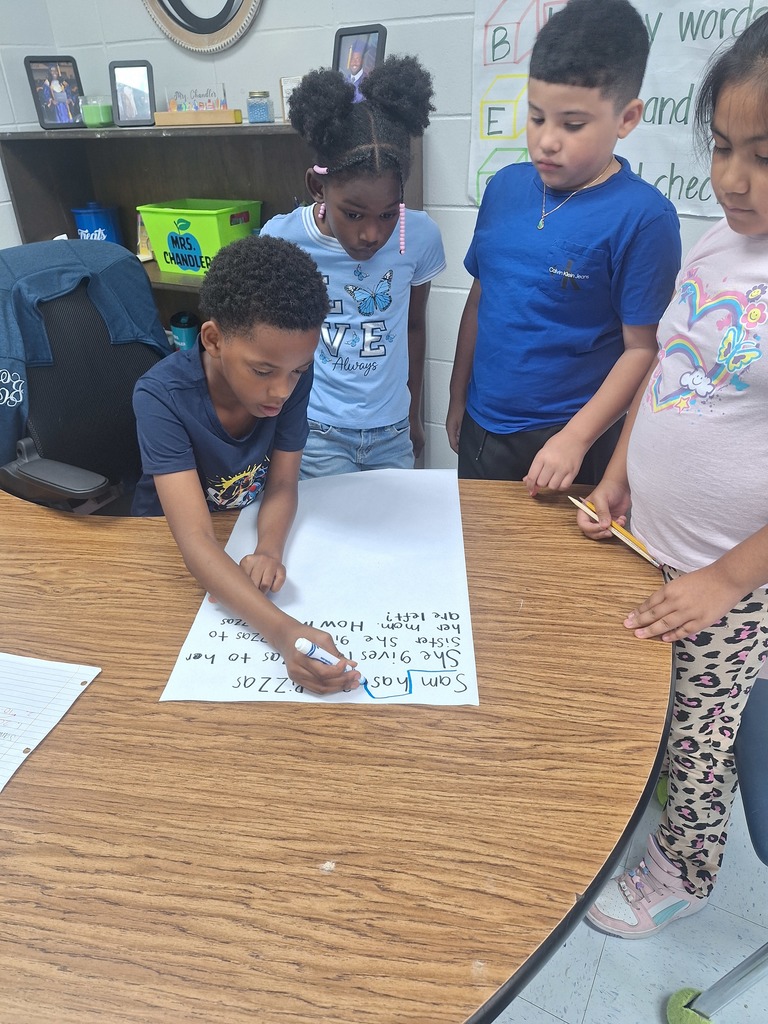 4 students work at a table