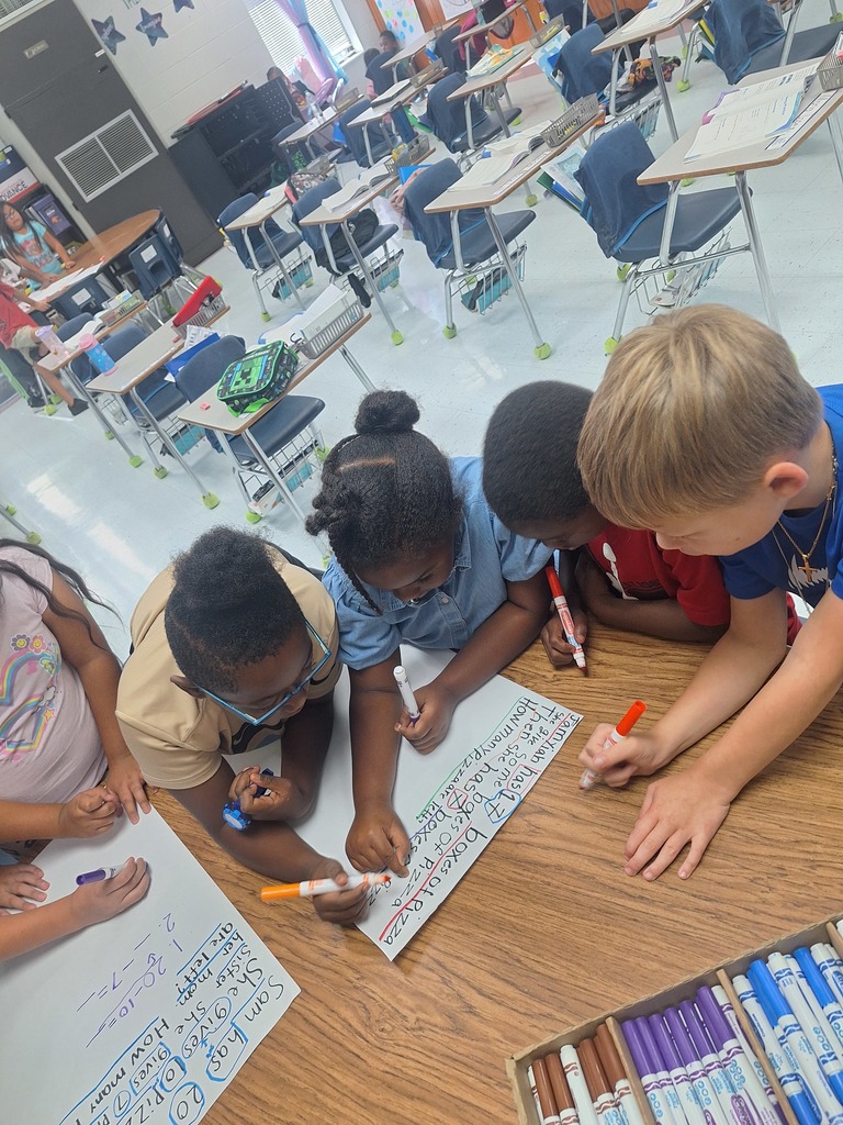 4 students work at a table