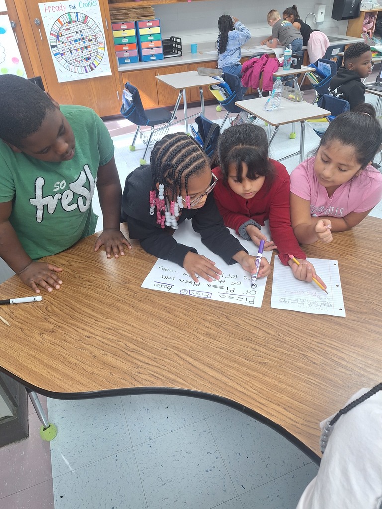 4 students work at a table