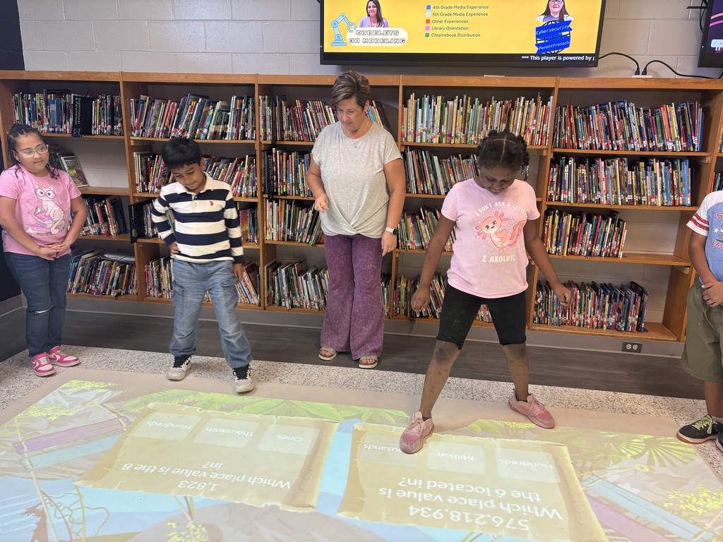 This image contains pictures of kids playing a math game on the active floor.