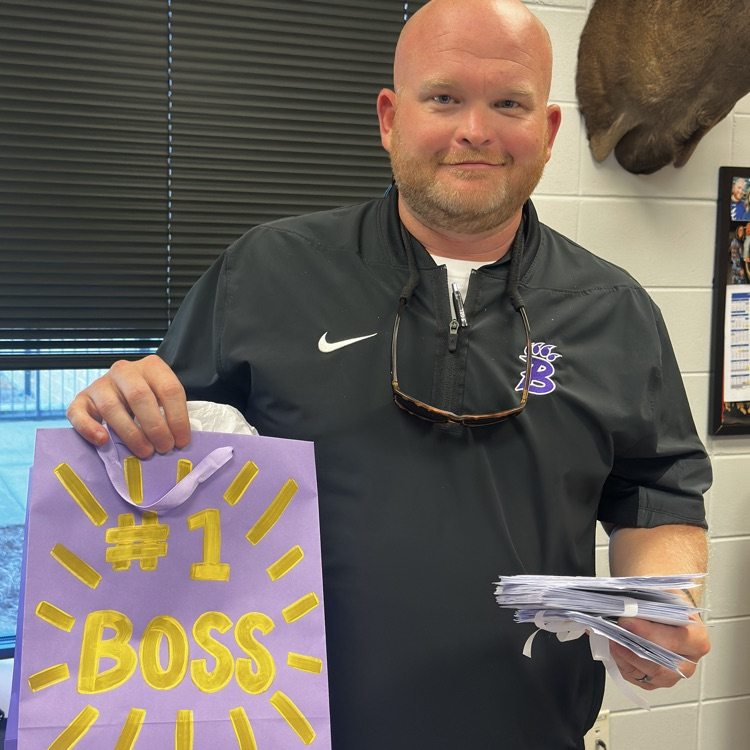 Principal Bryant holding his gift bag for Boss’s Day