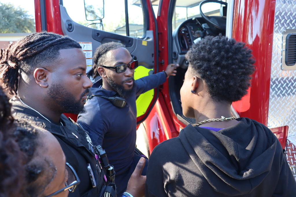 Students line up outside to view the City of Bainbridge Engine 3 fire truck during a hands-on learning event.