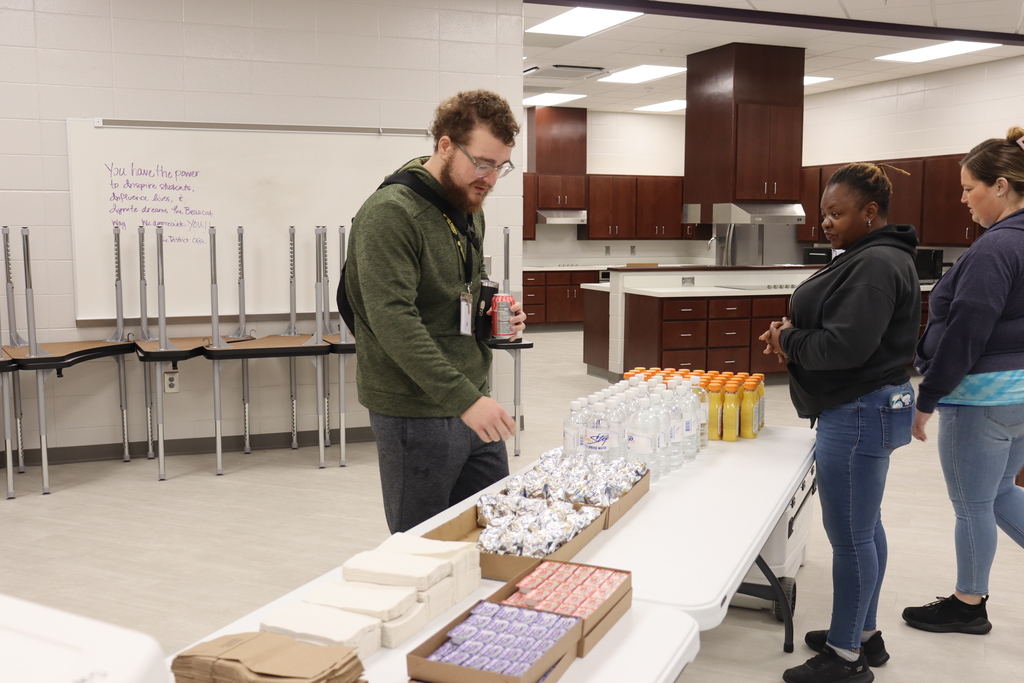 BMS staff line up to grab biscuits, juice, and water during the event.