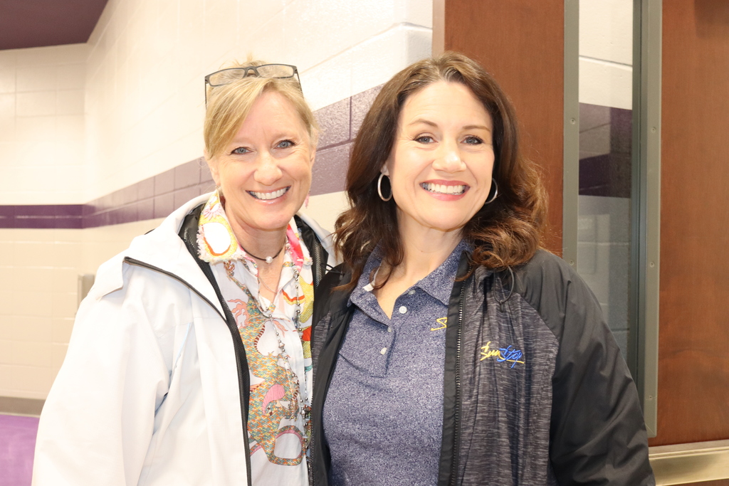 Two SunStop representatives smile together at Bainbridge Middle School’s Biscuits for the Best event.
