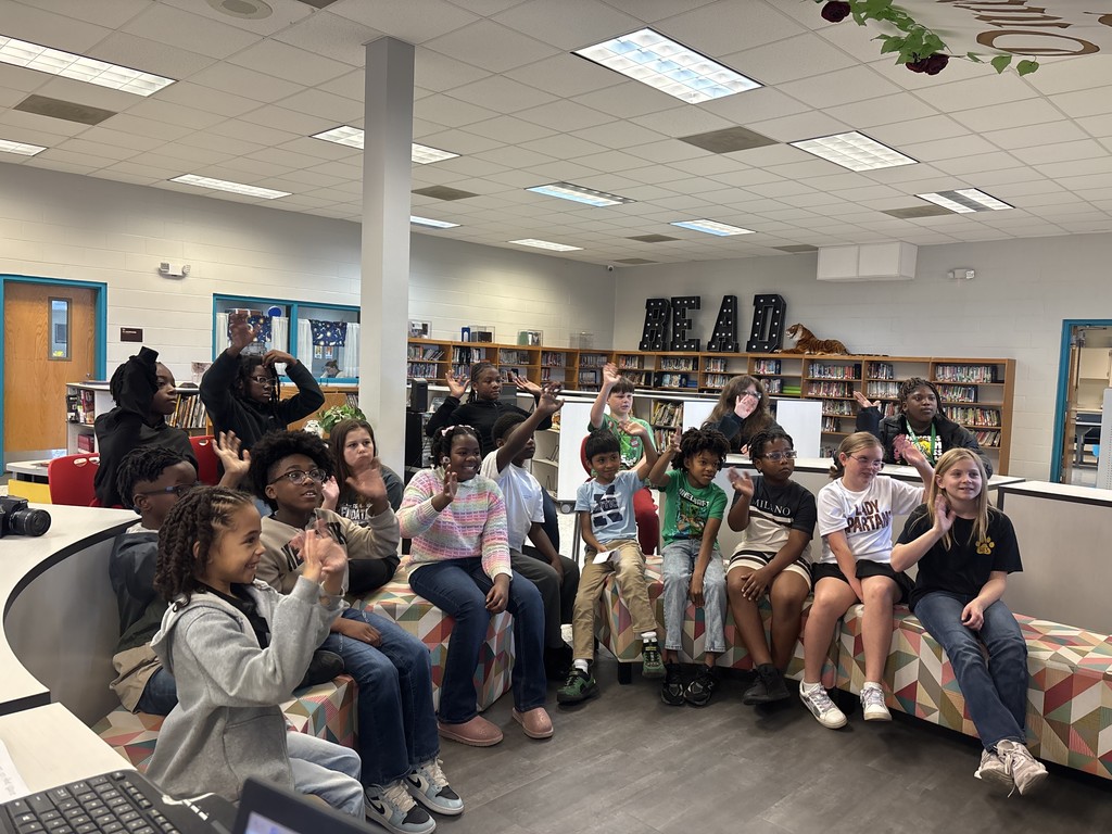 Students in the media center at Hutto Elementary wait to ask questions as representatives of their school during this week's Direct to Discovery Session.
