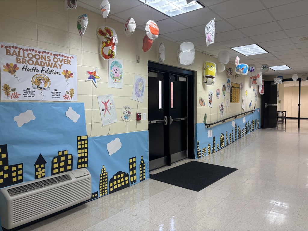 This image contains images of balloons students made for the hallway.