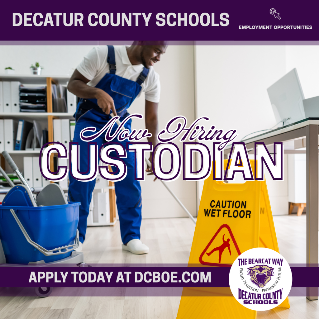 Custodian mopping a floor near a wet floor caution sign with “Now Hiring Custodian” text displayed.