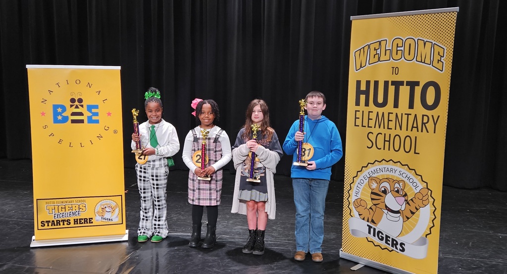 This image contains a picture of the winners from the spelling bee.