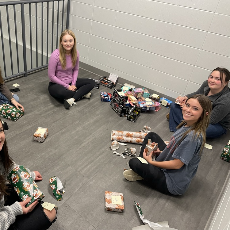 Anchor Club members were busy wrapping gifts this afternoon to deliver to the students at the Friendship House  this week. 