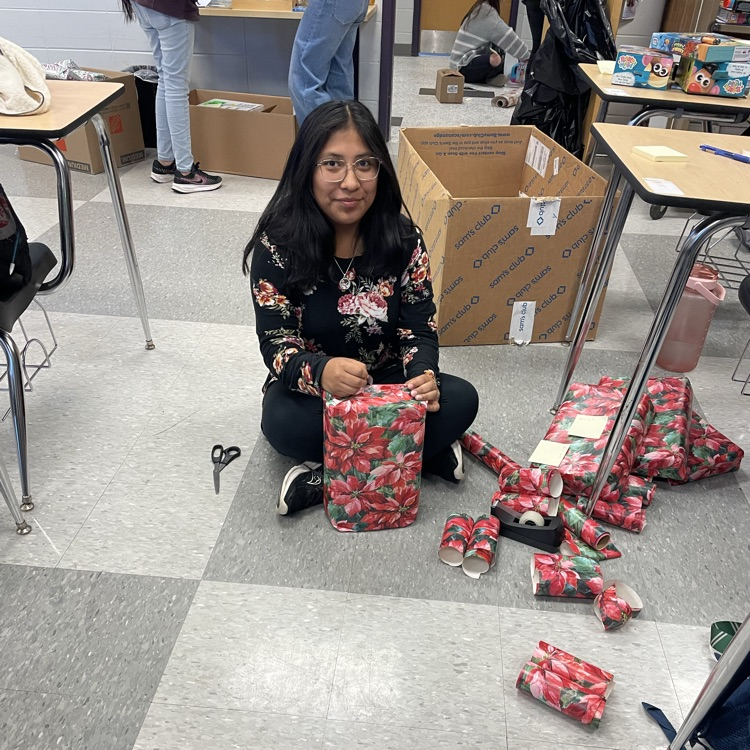 Anchor Club members were busy wrapping gifts this afternoon to deliver to the students at the Friendship House  this week. 