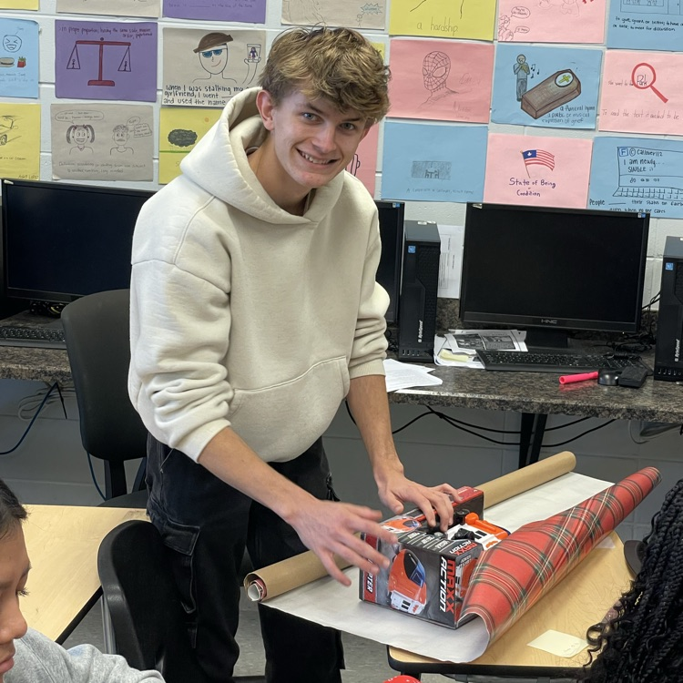 Anchor Club members were busy wrapping gifts this afternoon to deliver to the students at the Friendship House  this week. 