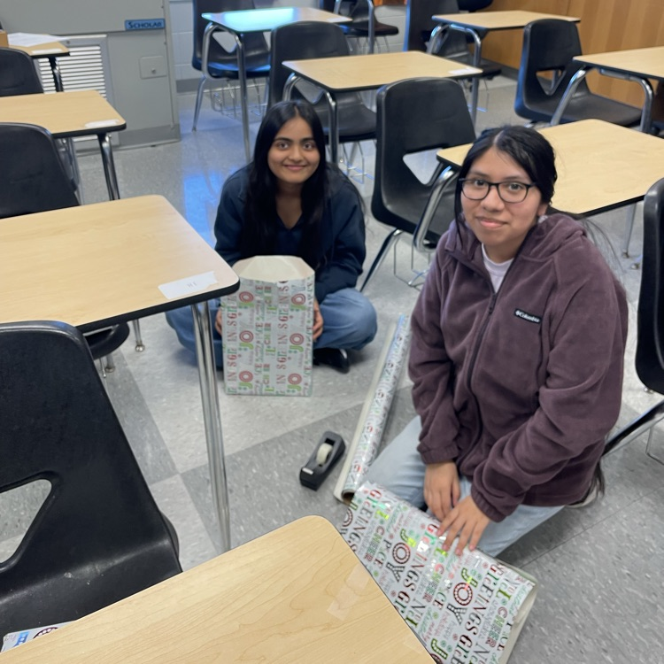 Anchor Club members were busy wrapping gifts this afternoon to deliver to the students at the Friendship House  this week. 