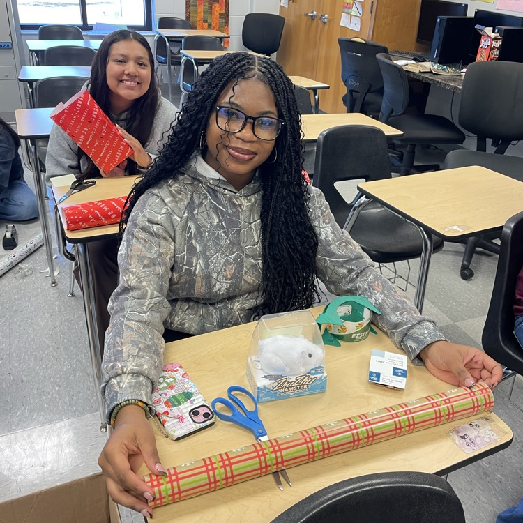 Anchor Club members were busy wrapping gifts this afternoon to deliver to the students at the Friendship House  this week. 