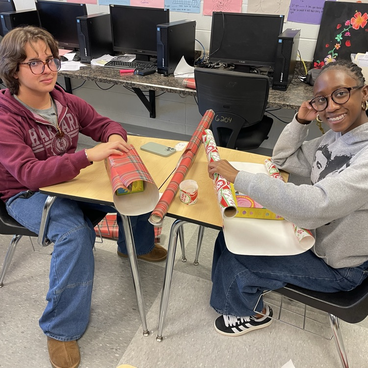 Anchor Club members were busy wrapping gifts this afternoon to deliver to the students at the Friendship House  this week. 