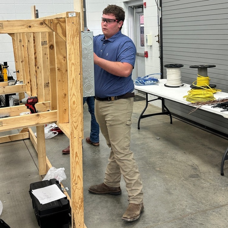 Kevin Ray is wiring a circuit for the 2026 Area 5 EMC Wiring Contest.