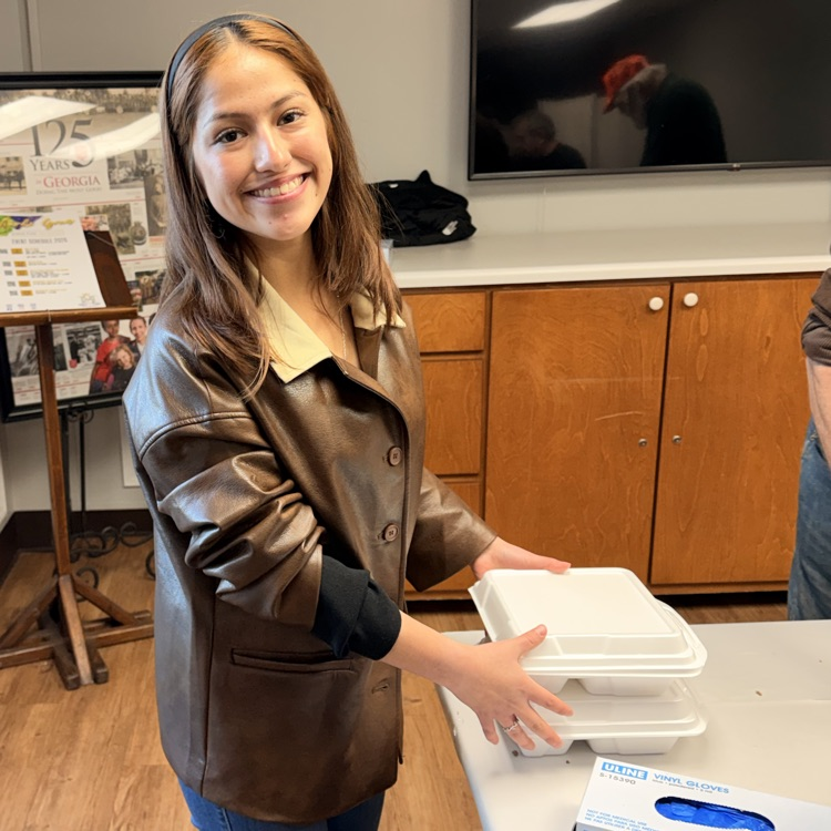 Anchor Club and Key Club members helped the Salvation Army distribute almost 600 meals as part of Supper on Scott tonight.