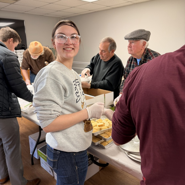 Anchor Club and Key Club members helped the Salvation Army distribute almost 600 meals as part of Supper on Scott tonight.