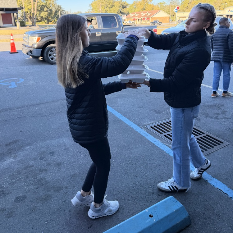 Anchor Club and Key Club members helped the Salvation Army distribute almost 600 meals as part of Supper on Scott tonight.