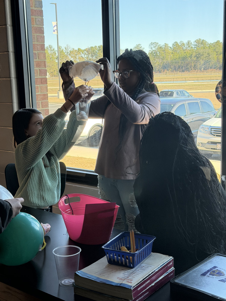 6th grade students collaborating on the one word STEM challenge.