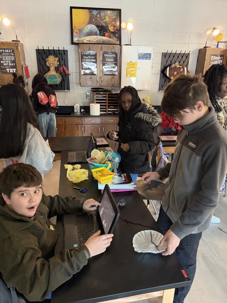 6th grade students collaborating on the one word STEM challenge.