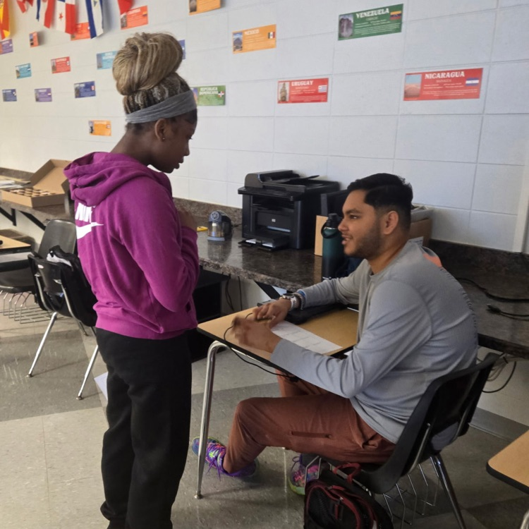 Spanish 2 students practice their interpersonal communication skills by discussing their food preferences.