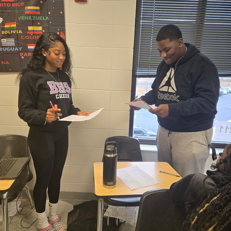 Spanish 2 students practice their interpersonal communication skills by discussing their food preferences.