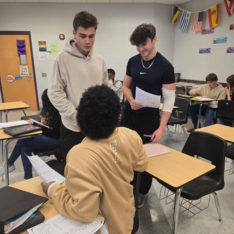 Spanish 2 students practice their interpersonal communication skills by discussing their food preferences.