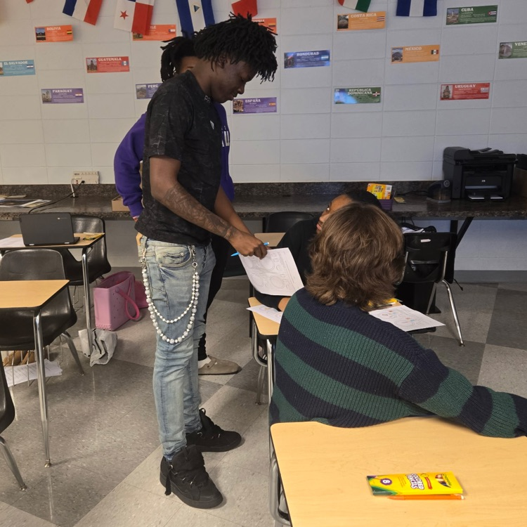 Spanish 2 students practice their interpersonal communication skills by discussing their food preferences.