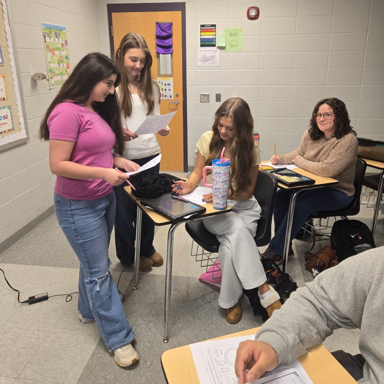 Spanish 2 students practice their interpersonal communication skills by discussing their food preferences.
