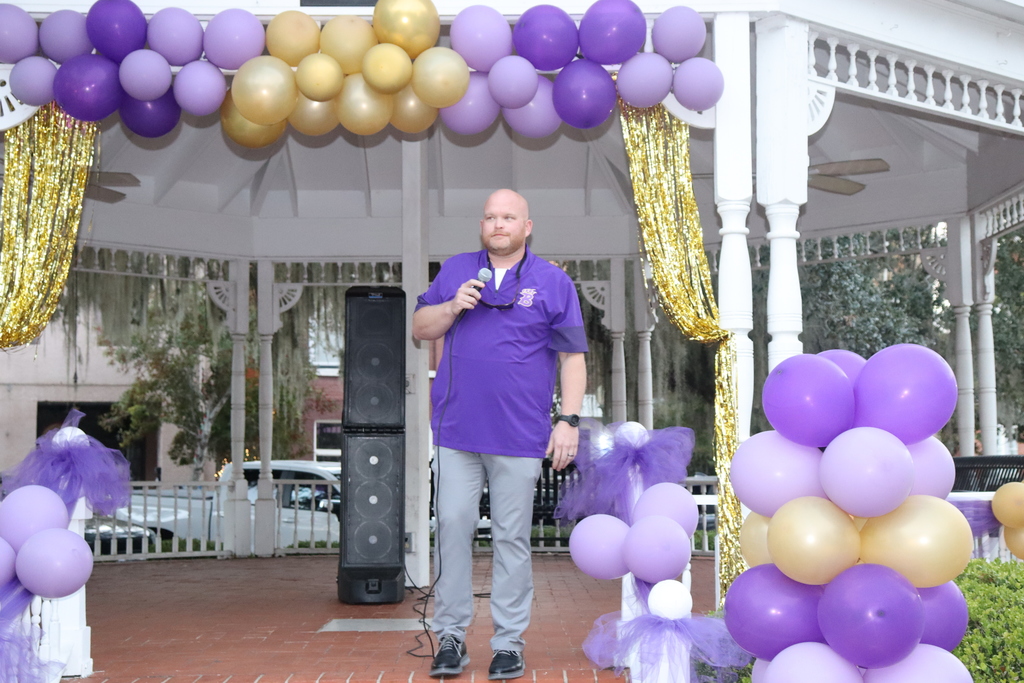 Speaker addresses the crowd at the decorated Willis Park Gazebo during the Coach DuBose Meet and Greet
