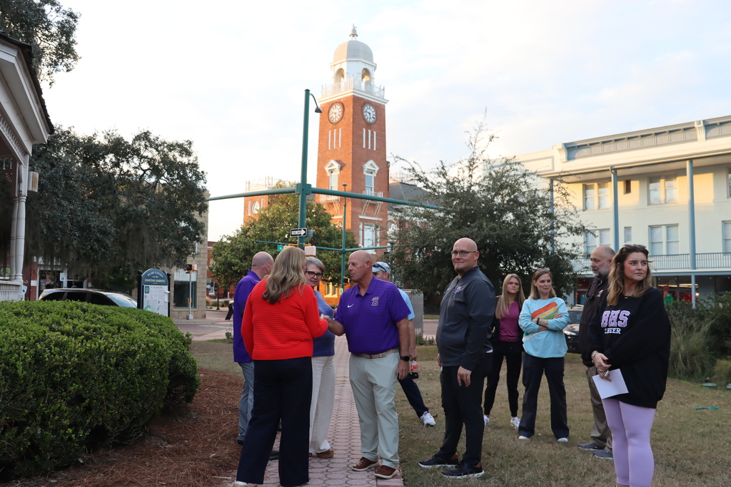 Community members greet Coach Jamey DuBose in Downtown Bainbridge.