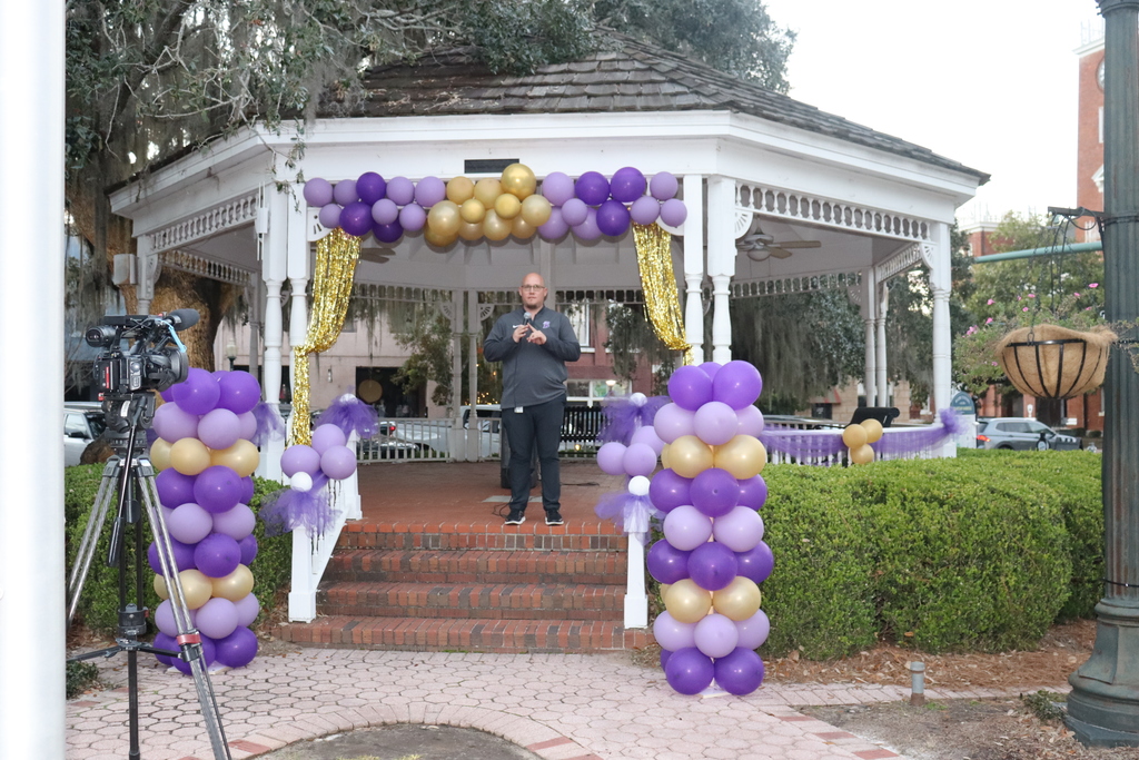 Speaker addresses the crowd at the decorated Willis Park Gazebo during the Coach DuBose Meet and Greet
