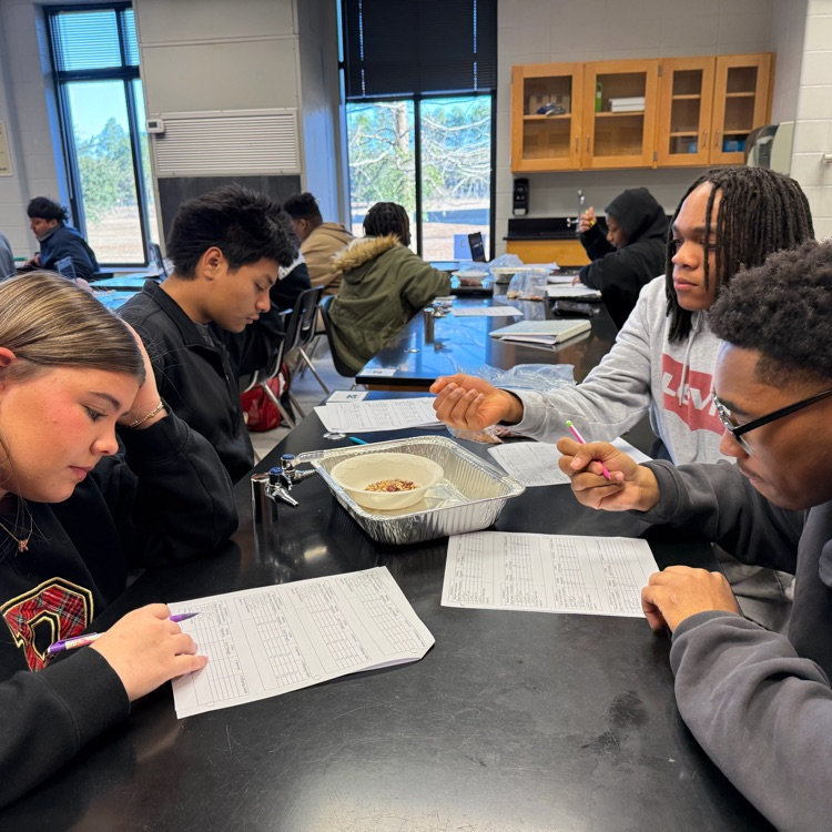 Students completed a natural selection lab in which they observed how microbe populations (modeled with beans) changed over multiple generations based on favorable traits, similar to real-life populations.