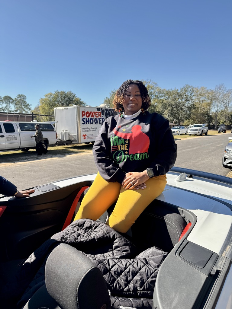 This image contains a picture of Mrs. Lewis the teacher of the year.