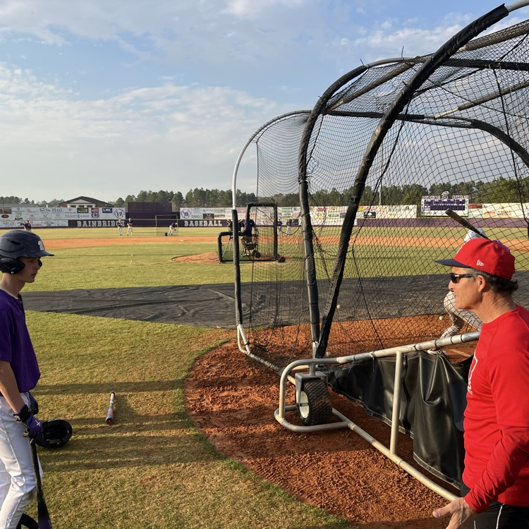 Coach Garber giving hitting tips 