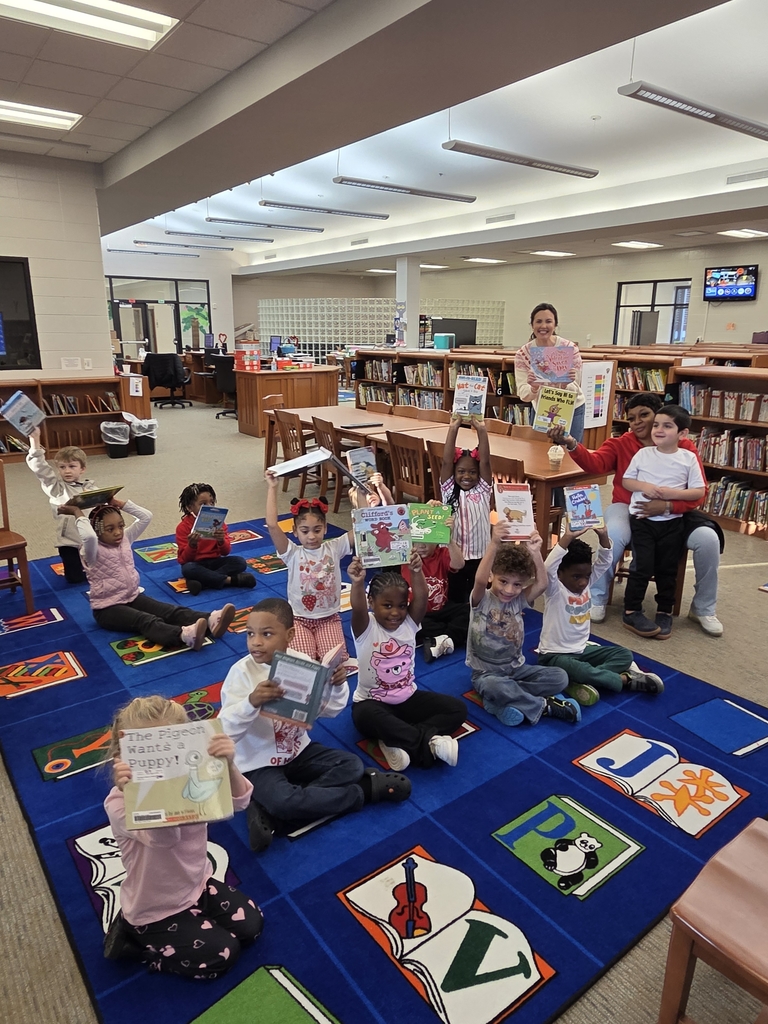 Mr.Alday's  class excited about reading!!! checking  out books for the first time.